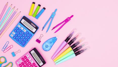 pastel back to school accessories appear on left side of pastel pink theme. stop motion