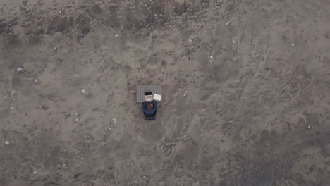 top-view of man working on isolated beach