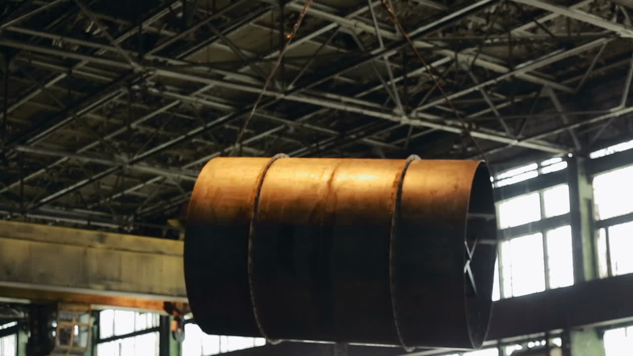 Overhead crane in factory. Overhead crane and hook inside factory building for lifting work