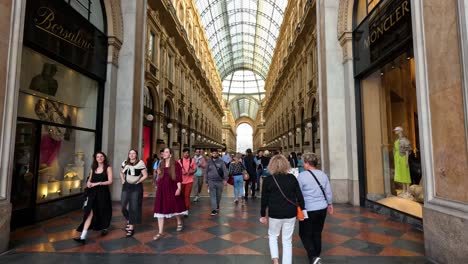 people walking through historic shopping arcade