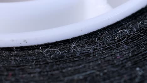 Duct-cloth-tape-dirty-with-dust-particles,-macro-shot-with-rotation-motion-from-very-close-up-view