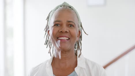 Portrait-of-happy-african-american-senior-woman-at-home,-slow-motion