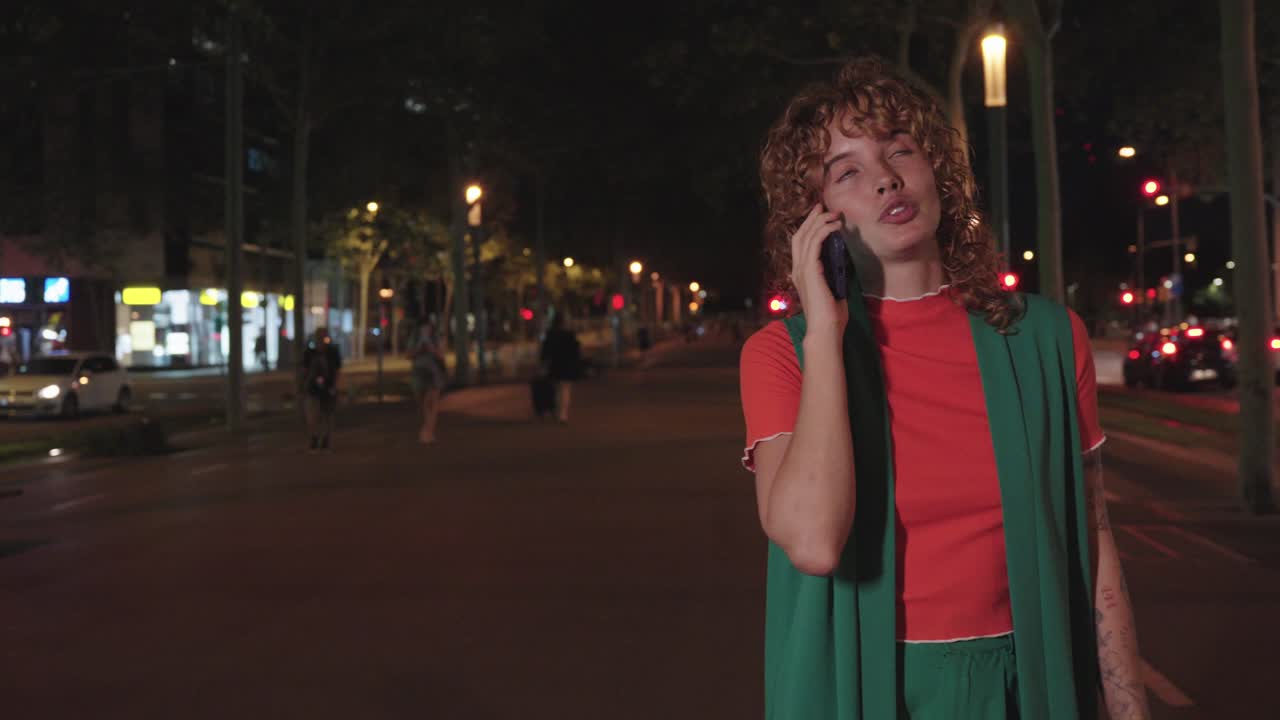 Woman talking on the phone at night