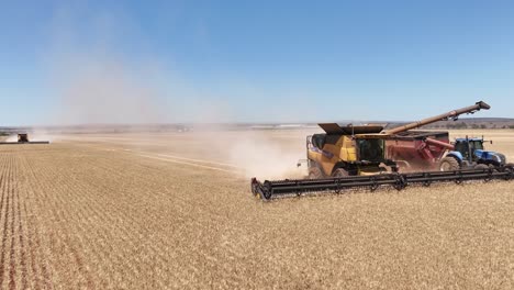 This-footage-captures-the-synergy-of-modern-agricultural-technology,-showcasing-the-essential-role-of-header-fronts-in-the-wheat-harvesting-process