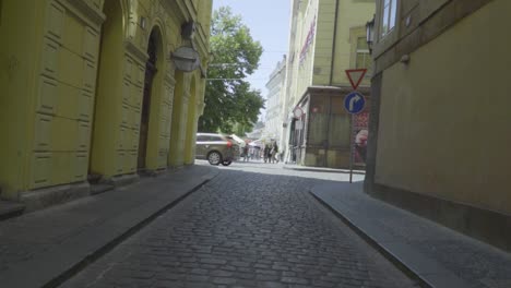 cobblestone sidewalk alley in european streets of prague - rotating