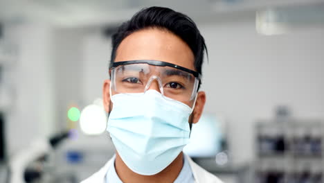 happy male scientist wearing a mask