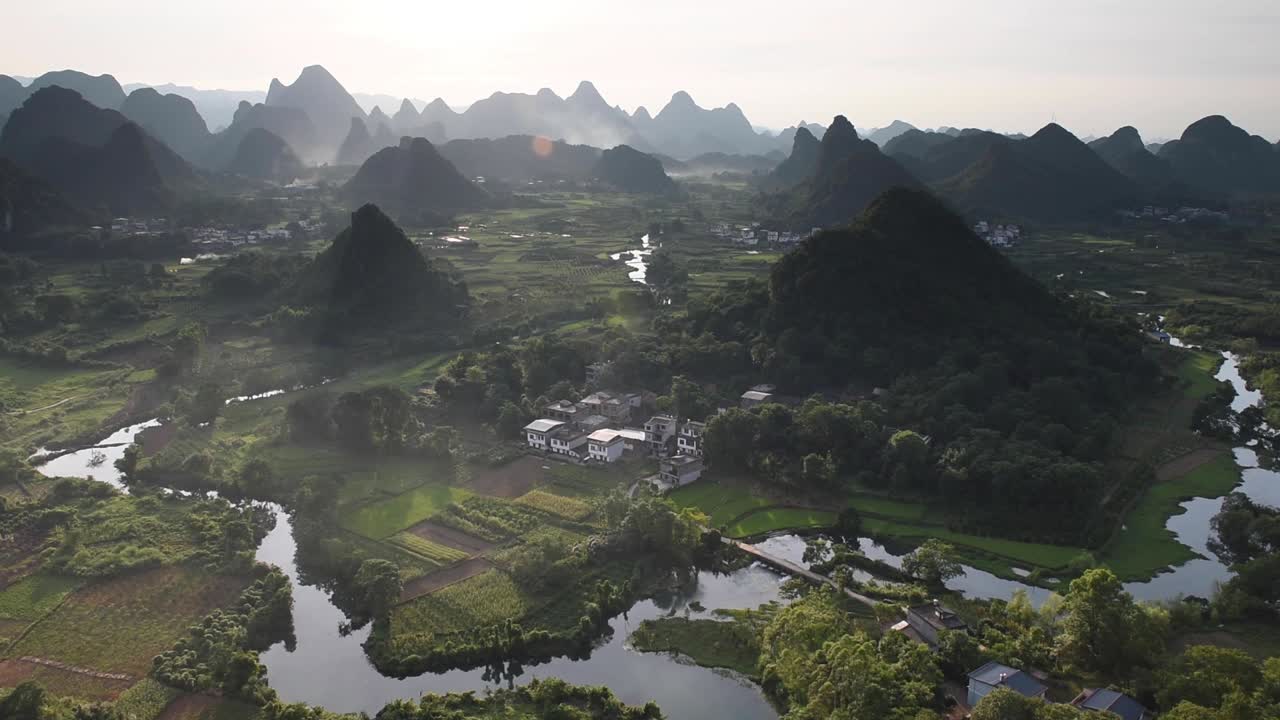 Yangshuo in Guangxi, China, is famous for its dramatic karst mountain landscape, winding rivers, and lush countryside. A popular travel destination