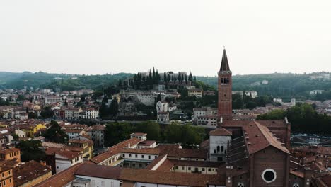 aerial view pushing towards the arno river in verona, italy