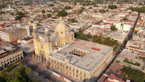 bird's eye view of cathedral basilica of colima with government palace in colima city, mexico