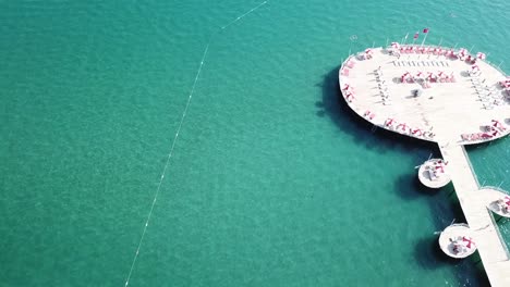 luxury beach pier with sunbeds and umbrellas