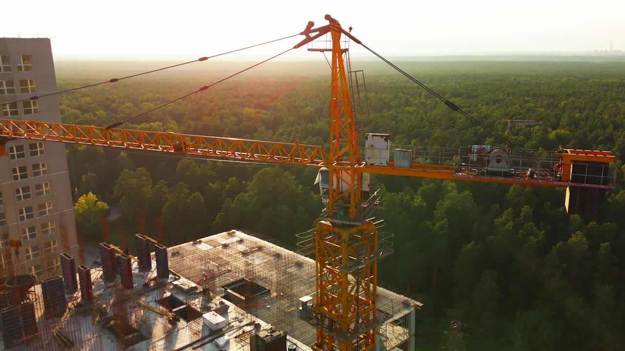 Construction Crane at High-Rise Building Under Construction