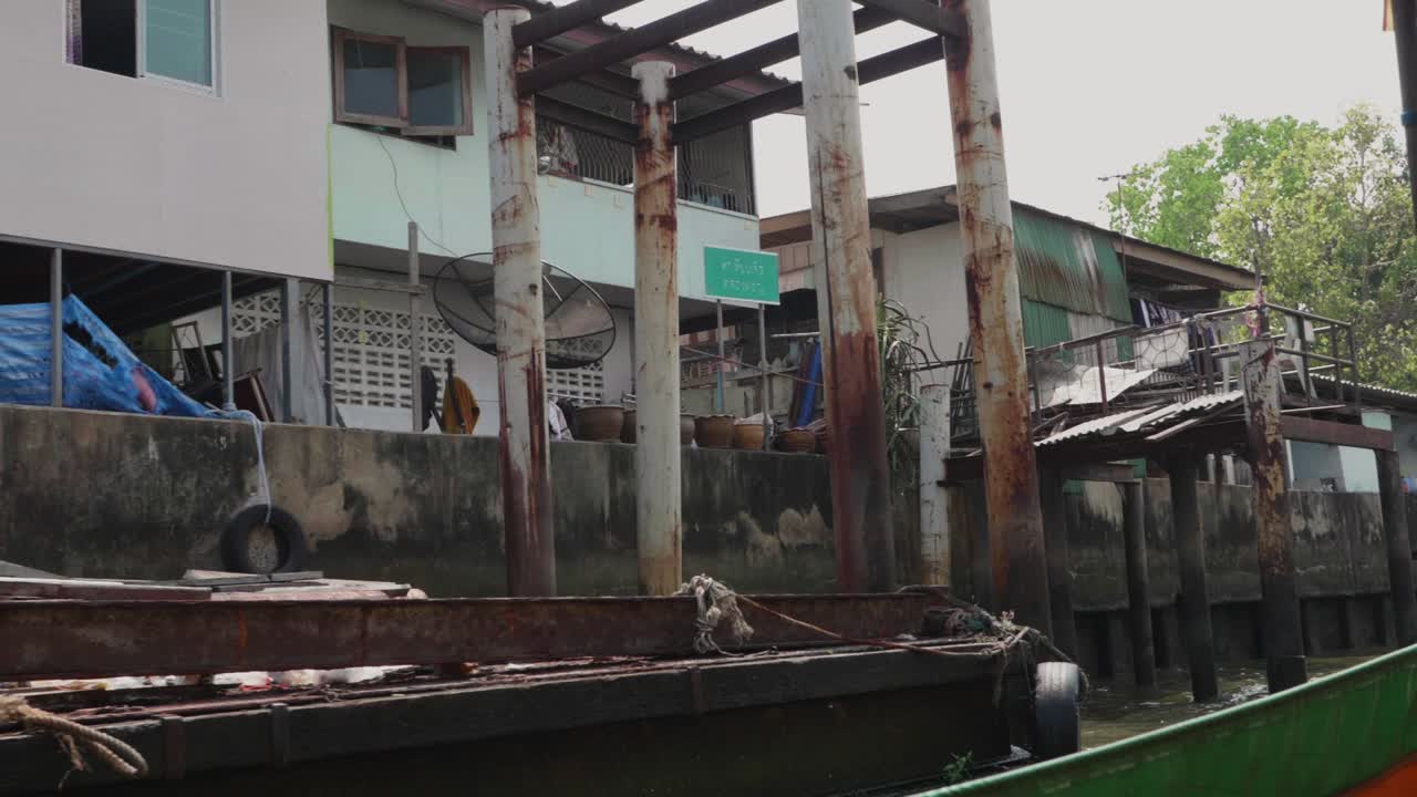 Poor Local Homes by the Dirty Canal in Bangkok. Slow Motion.