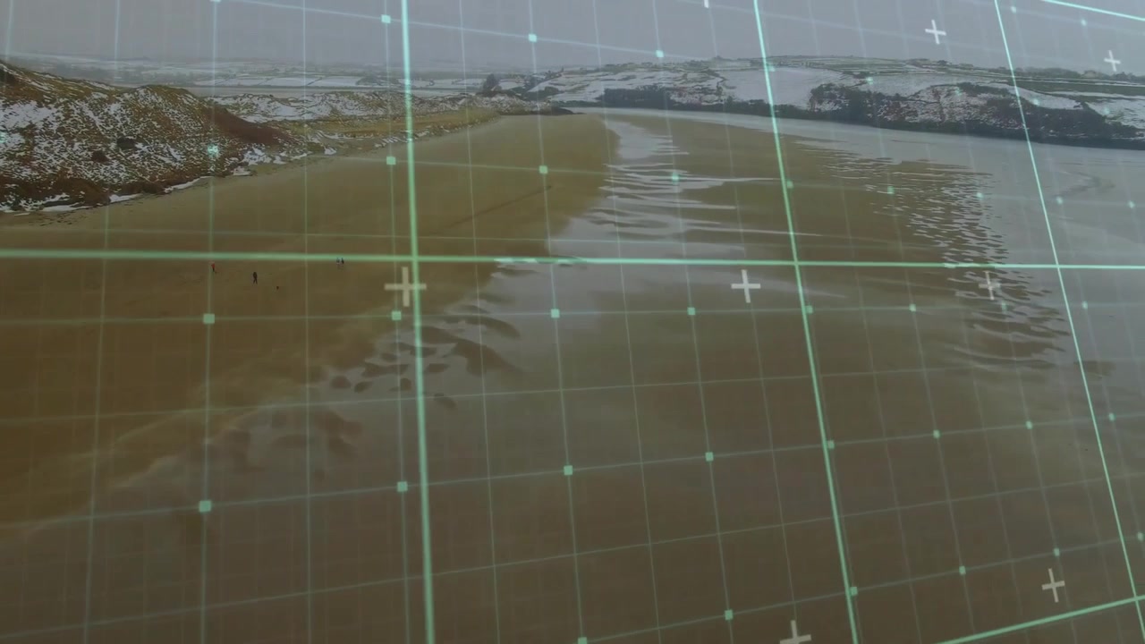 Aerial View of Winter Beach with Digital Data Overlay