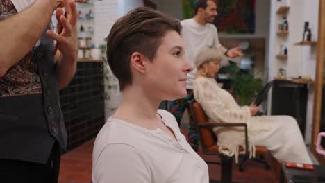 woman getting a haircut at a hair salon