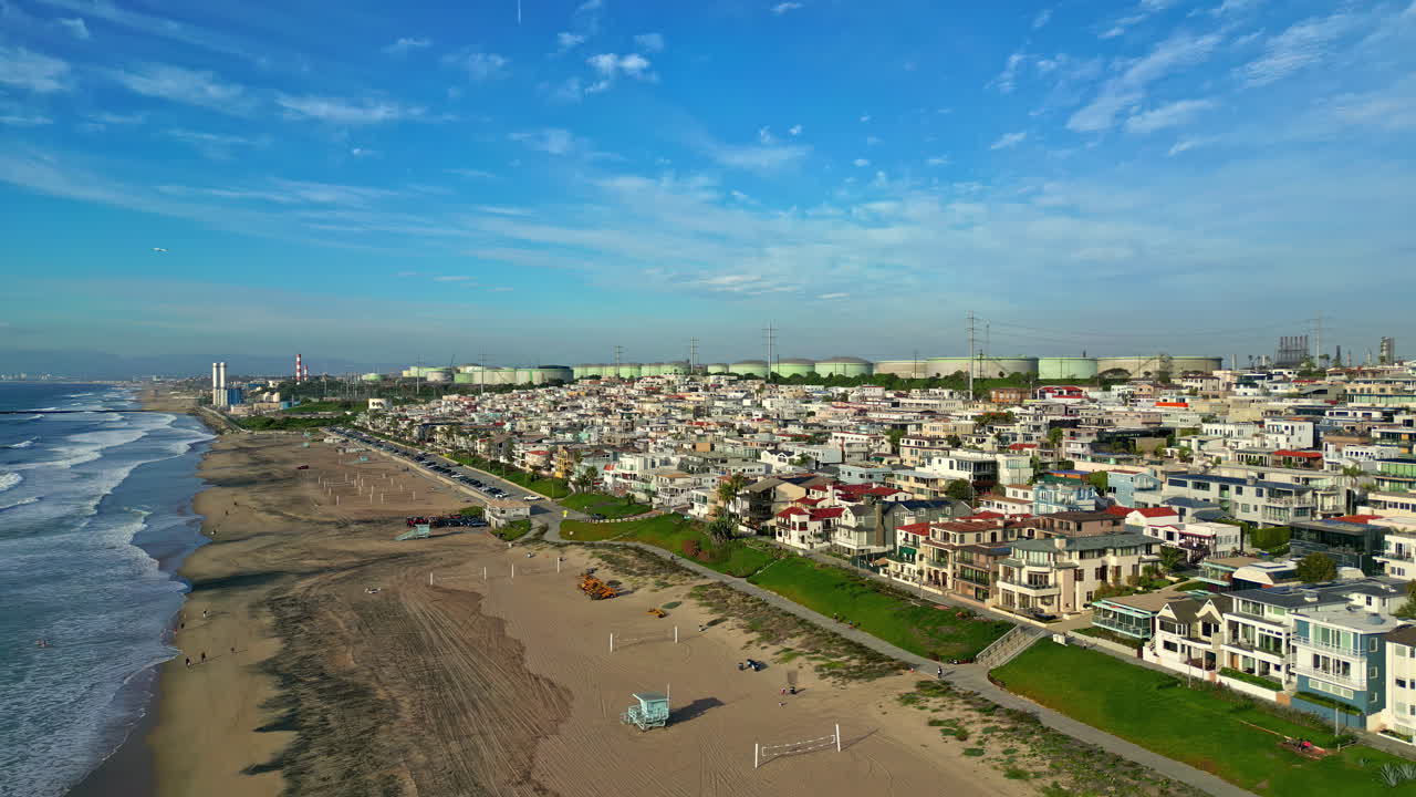 Manhattan beach on a sunny day. Aerial dolly in view