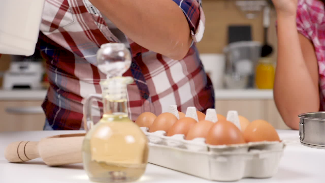 Preparing to Bake a Cake with Eggs and Flour