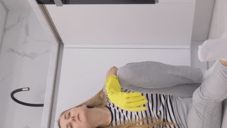 woman cleaning bathroom