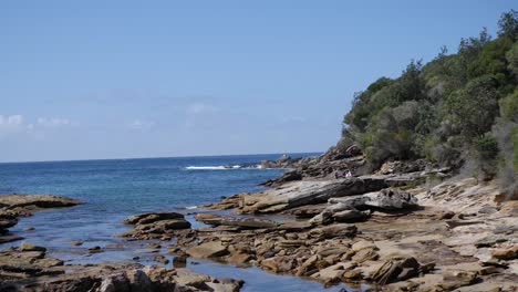 Wide-shot-of-a-rocky-coast-in-the-royal-national-park-in-Australia-near-Sydney-with-ocean-and-bush-forest