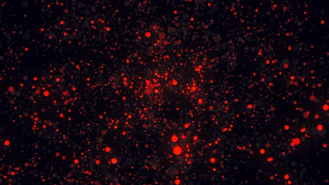 partículas rojas en fondo oscuro
