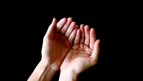 male hands gesture on black background.