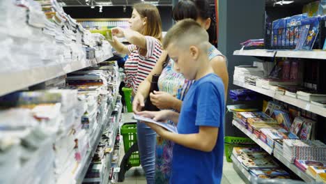 Vinnitsa, Ukraine - August, 2018: Back to school concept. Purchase of stationery in the store