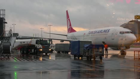 turkish airlines boeing at airport during cloudy sunset