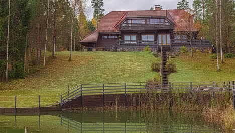 Small-pond-in-front-of-a-farm-house-cottage-in-the-middle-of-a-forest