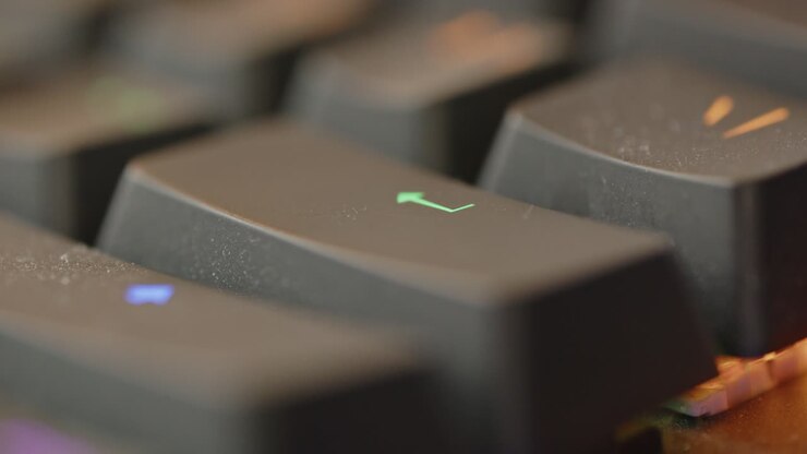 Macro view of Enter key being tapped multiple times
