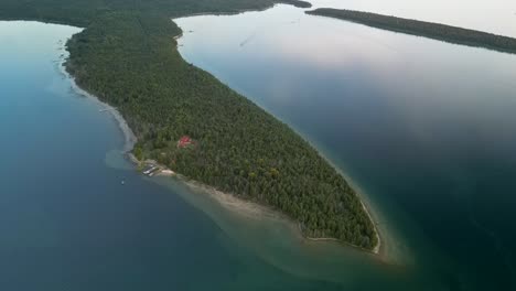 Aerial-view-of-Marquette-Island-peninsula-calm-evening,-Lake-Huron,-Michigan