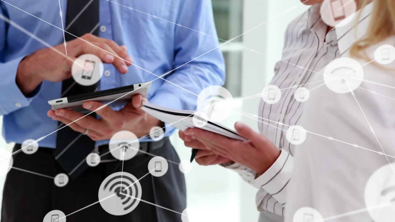 Using tablets and documents, business professionals networking with animation