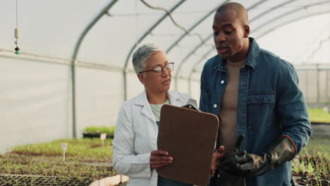 Farmer,-scientist-and-handshake-in-greenhouse