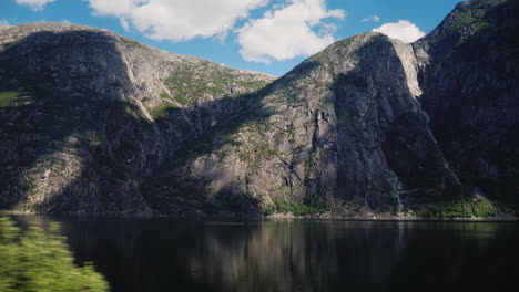 fjord and mountains - nature of norway view from the window of the vehicle 4k video