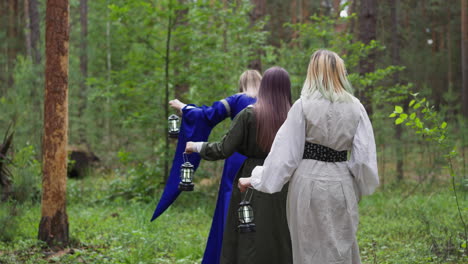 young girls in medieval long dresses walking