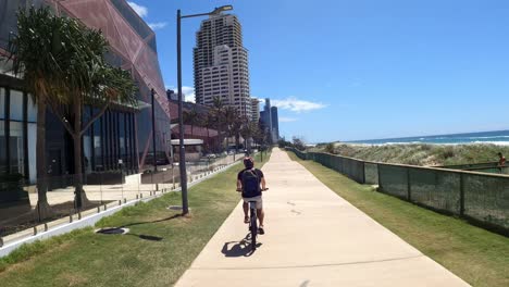 cyclist riding through diverse urban landscapes