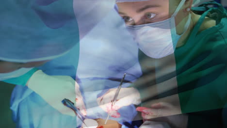 animation of flag of nigeria waving over surgeons in operating theatre