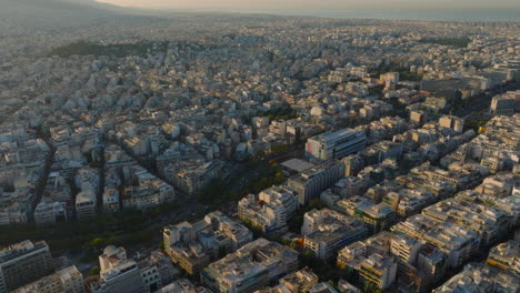 aerial shot towards large highway passing through central athens