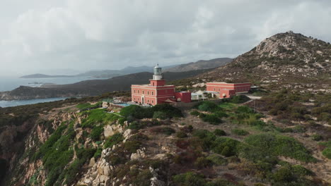 faro di capo spartivento, sardinia: wonderful aerial view in close orbit of the fantastic lighthouse of the island of sardinia