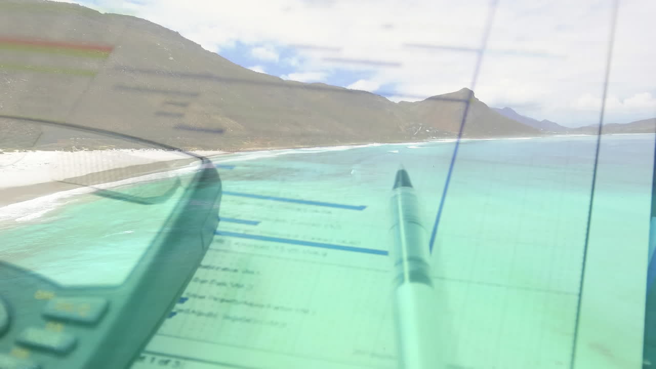 해변의 공중 전망 위에 오래된 전화로 테이블에 누워있는 차트와 그래프의 애니메이션