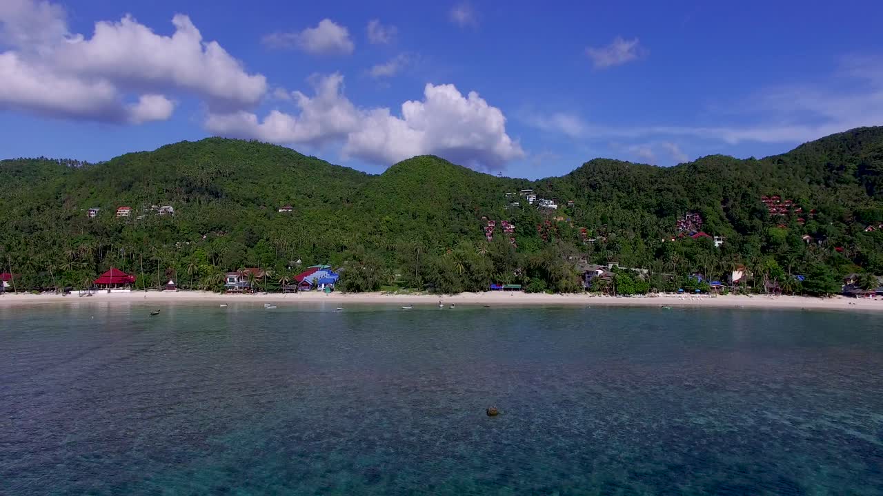 A pull-out drone shot of Haad Yao also known as Long Beach located in the north west coast of Phuket island in the South of Thailand