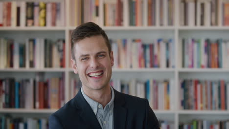 portrait confident young businessman laughing enjoying successful business lawyer in library bookshelf background slow motion