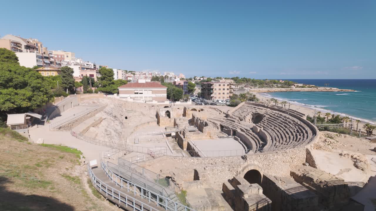 Ancient Roman Amphitheatre in Tarragona with sea views and historic ruins in Spain
