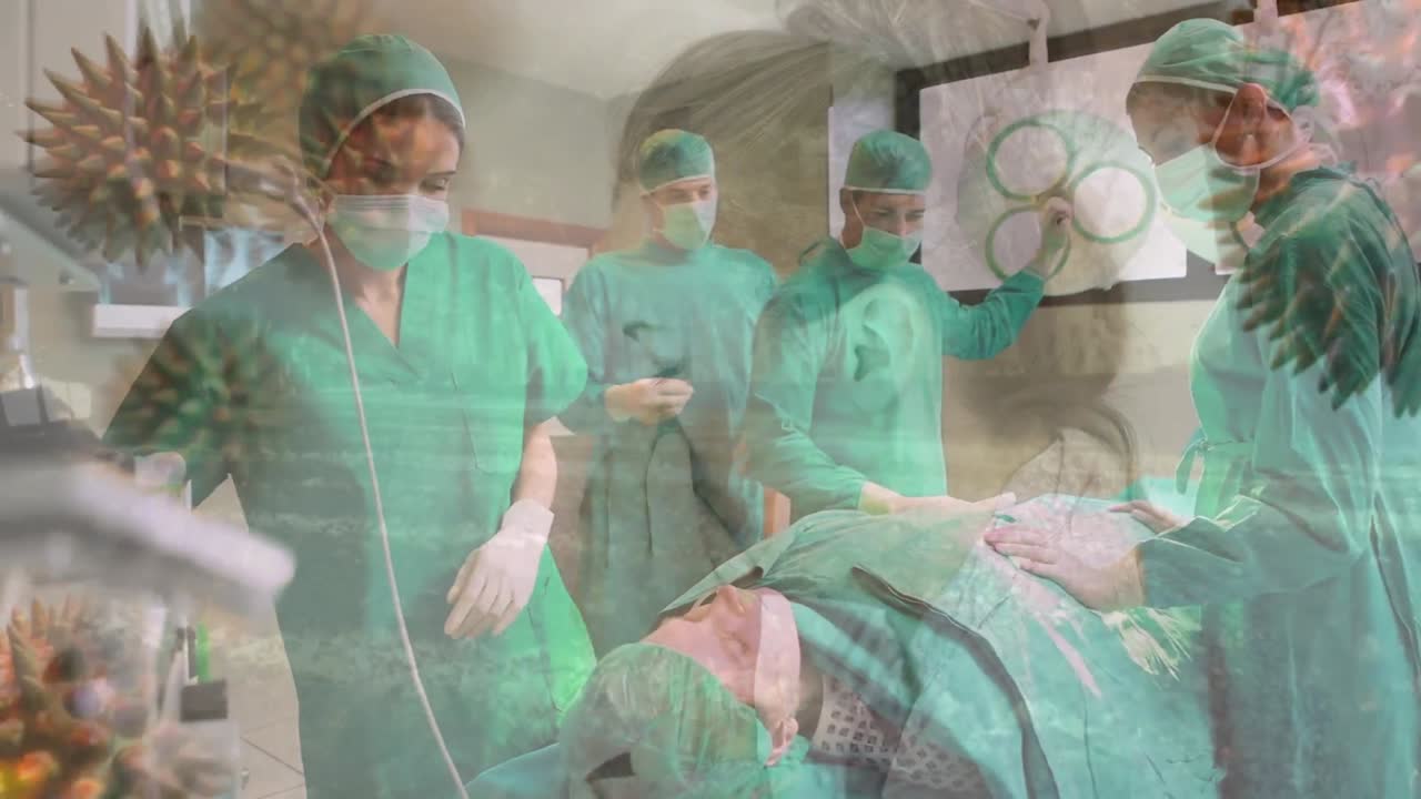 animación de células de covid-19 sobre diversos cirujanos que usan máscaras faciales en el quirófano