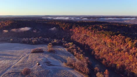 high altitude aerial view of fall colors on a bluff beside a pasteur