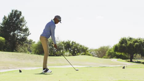 Video-of-african-american-man-playing-golf-on-golf-filed