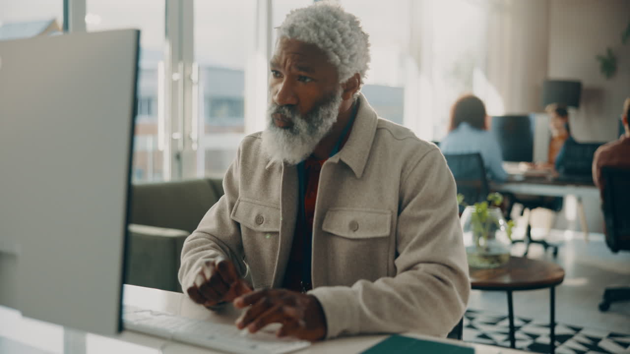 Senior man thinking in office