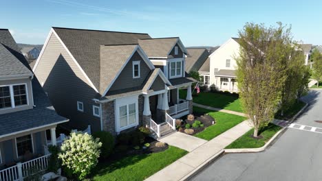 Rising-drone-shot-of-modern-residential-area-with-new-build-homes-in-white-grey-style