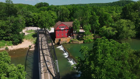 aerial view of truss bridge and river at war eagle mill near rogers, arkansas usa