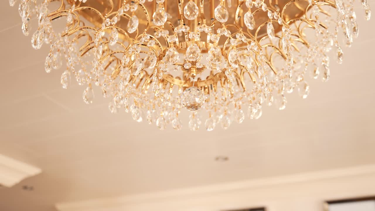 Rotating up shot of bottom hanging crystal chandelier