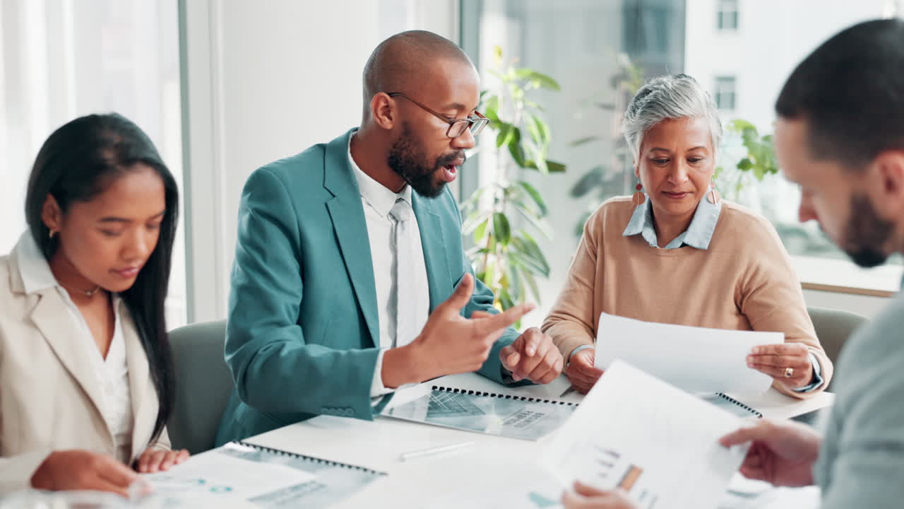 Business team collaborating on project in modern office