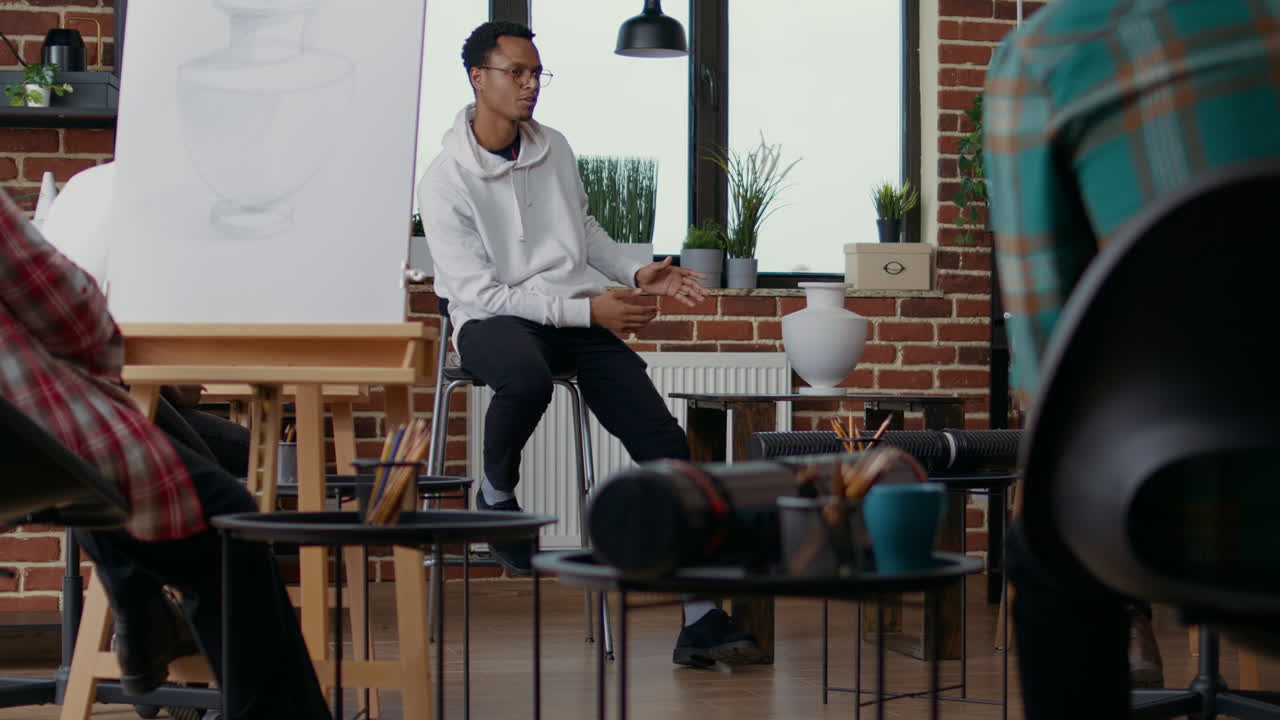 African american teacher explaining artistic vision to students